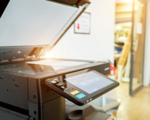 A selection of modern copiers and printers in an office setting, designed to enhance workflow and document management
