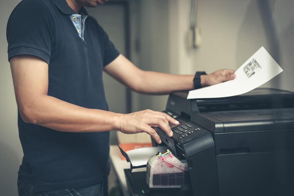 Businessman Using a Printer