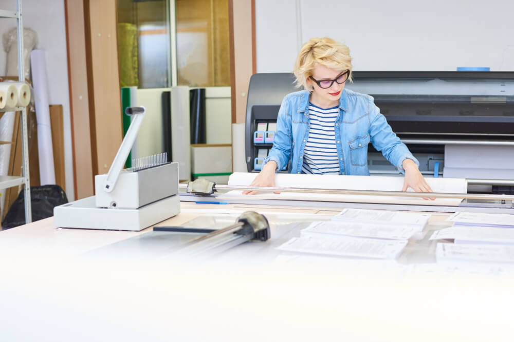 Portrait of Young Blonde Woman Working in Modern Printing Shop