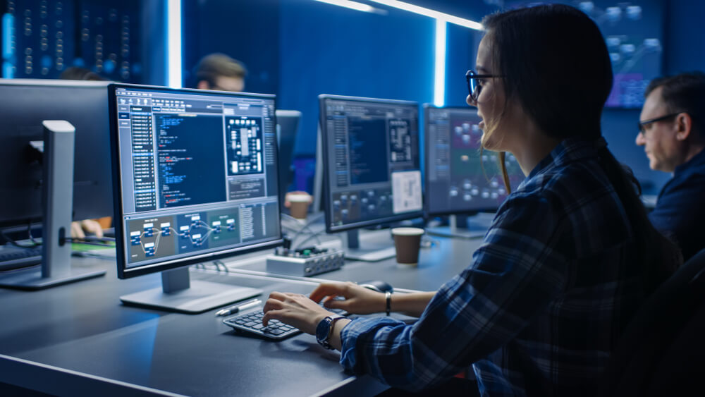 It Programmer Working on Desktop Computer in Data Center System Control Room