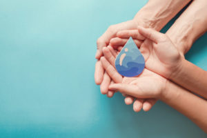 Hands Holding Clean Water Drop