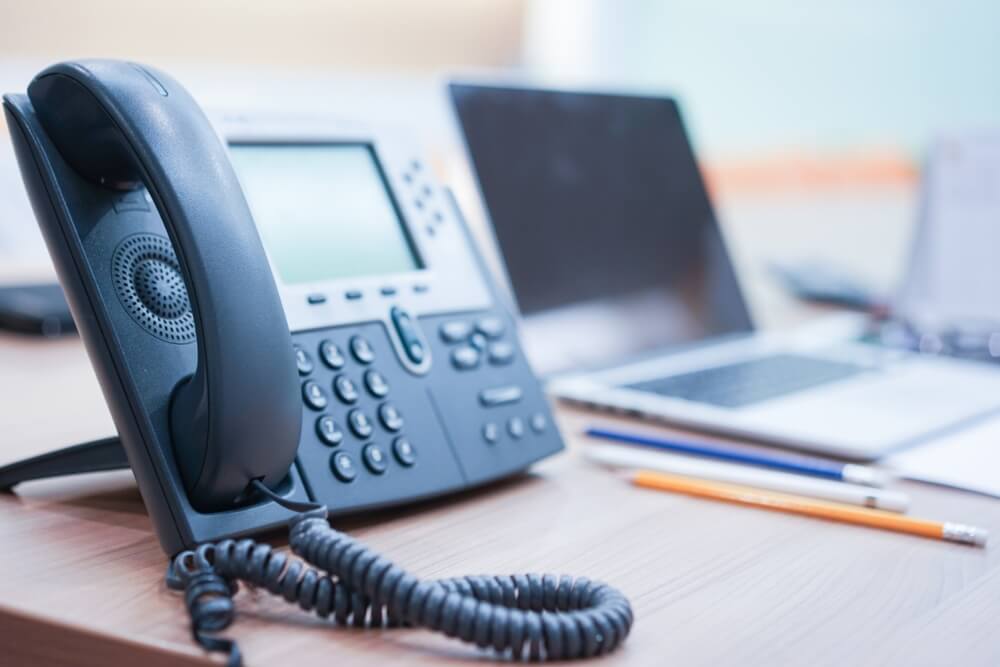 Telephone Device at Office Desk for Customer Service Support