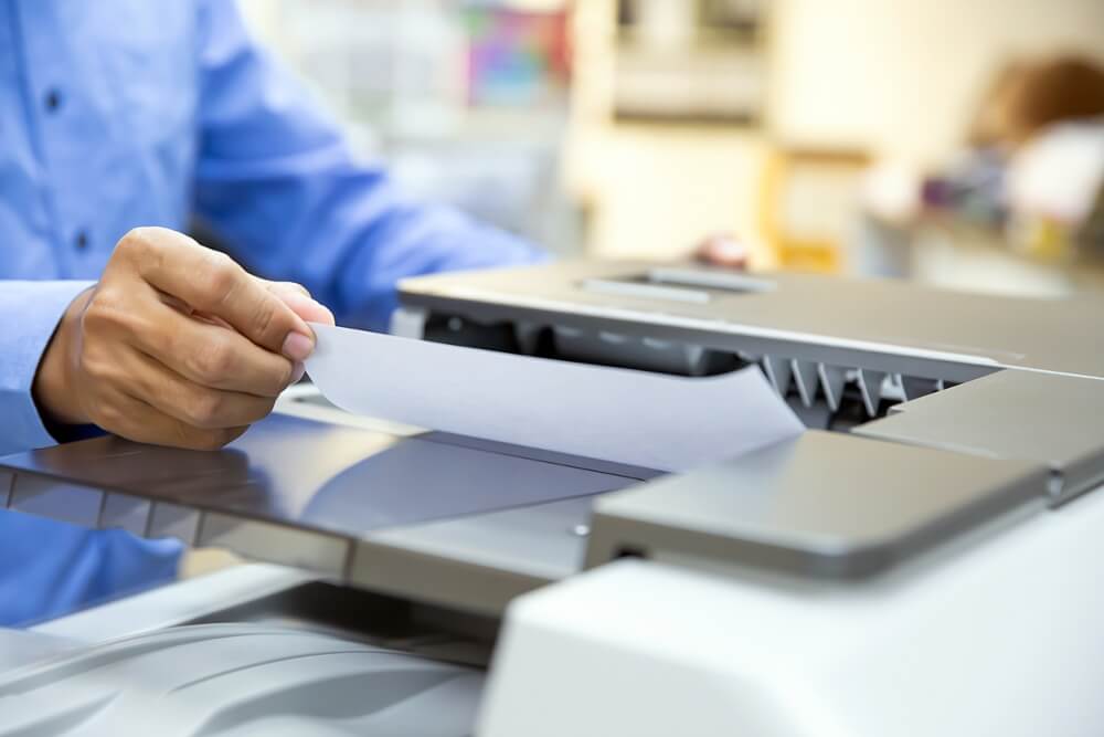 Businessmen Load Paper in the Copier and Useing Photocopier or Printer for Printout, Scanning, Exrox Documents Papers at Office