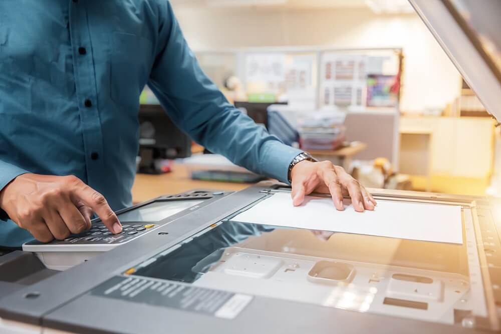 Businessmen Press Button on the Panel for Using Photocopier or Printer for Printout and Scanning Document Paper at Office