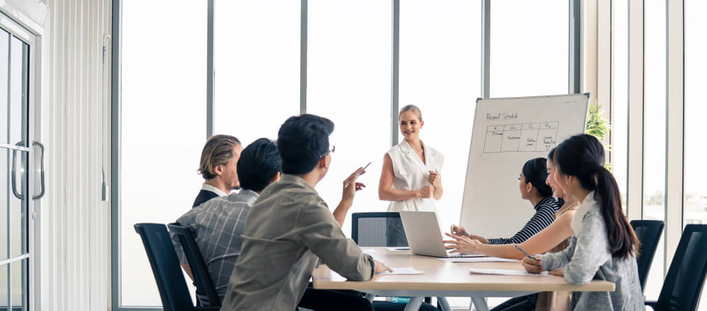 Woman Leader Working Brainstorm to Solve Problem With Team