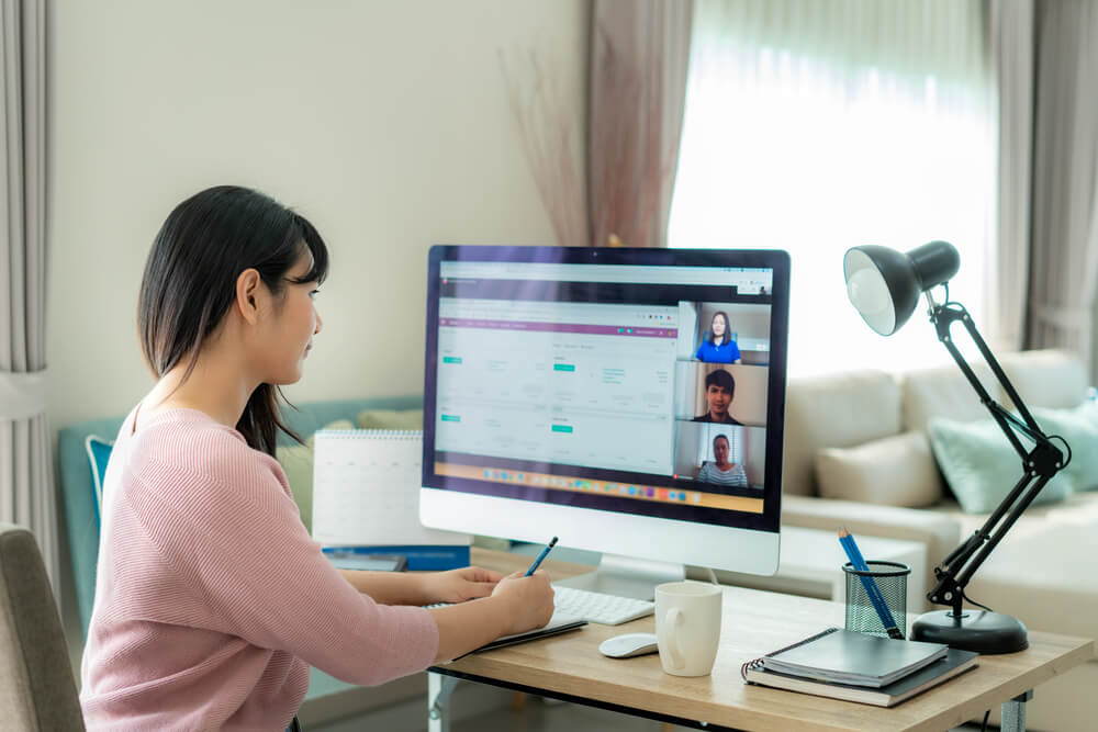 Business Woman Talking to Her Colleagues About Plan in Video Conference. 