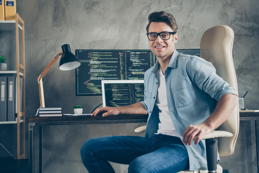 Portrait of Positive Guy It Specialist Sit Chair Desk Enjoy Working PC Home