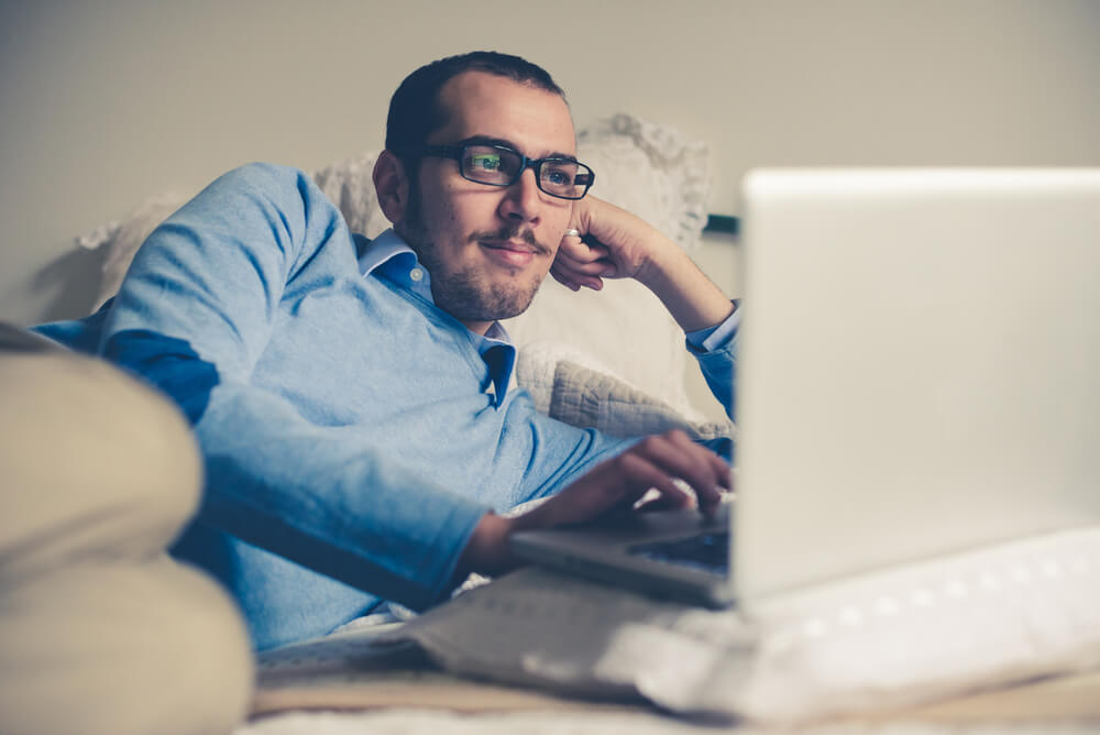 Elegant Business Multitasking Multimedia Man Using Devices at Home