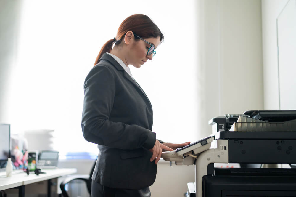 Woman Using a Copier Machine